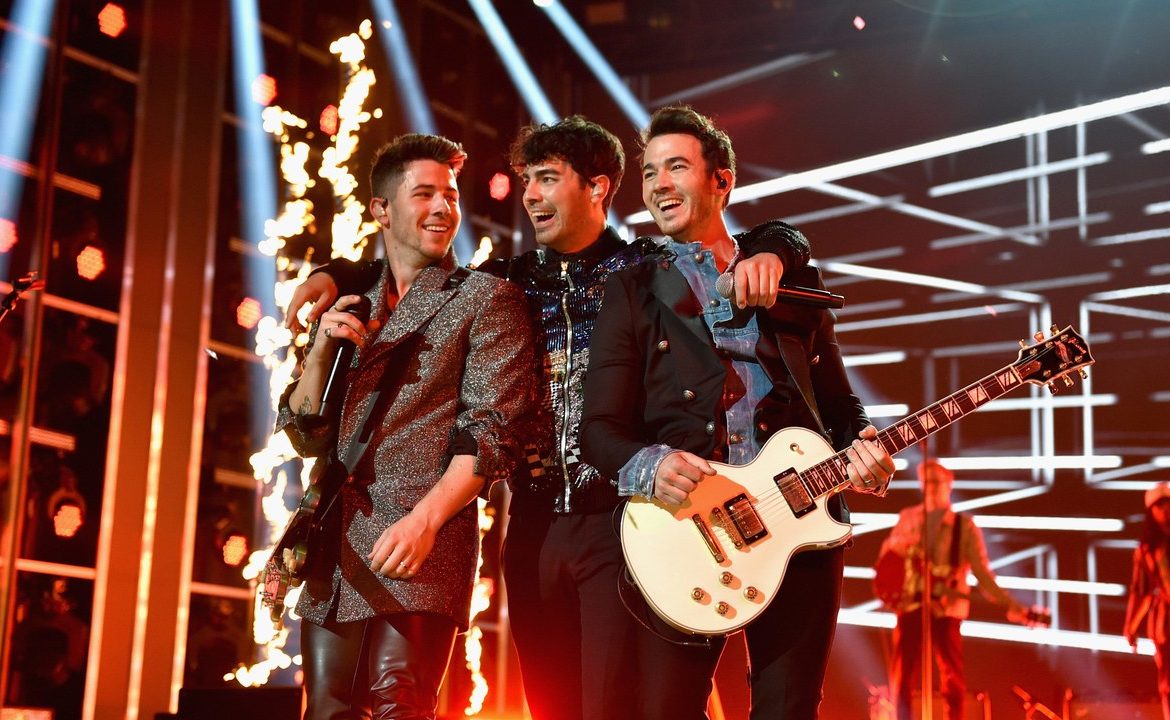 Nick, Joe, and Kevin on stage