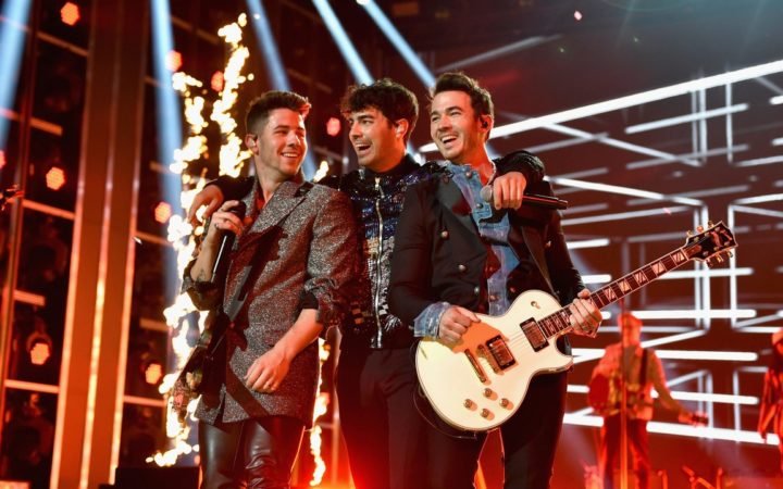 Nick, Joe, and Kevin on stage