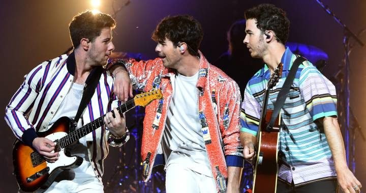 Nick, Joe, and Kevin performing live