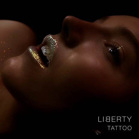 Singer/Songwriter Liberty Roche sporting gold glitter lipstick